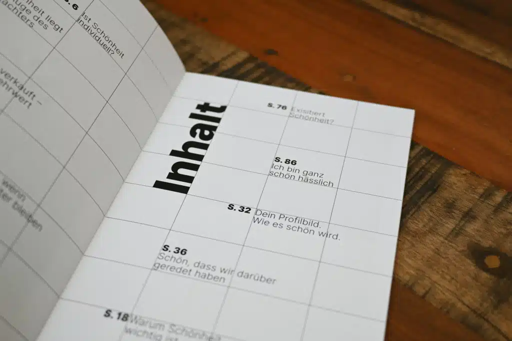 a close up of a book on a wooden table